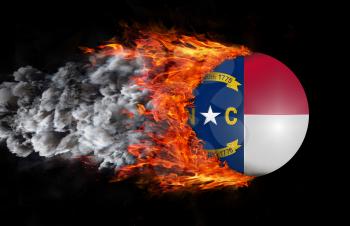Concept of speed - Flag with a trail of fire and smoke - North Carolina