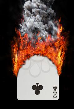 Playing card with fire and smoke, isolated on white - Two of clubs