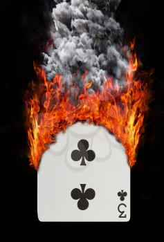 Playing card with fire and smoke, isolated on white - Three of clubs