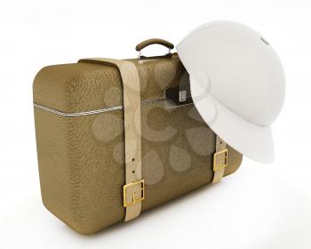 Brown traveler's suitcase and peaked cap on a white background