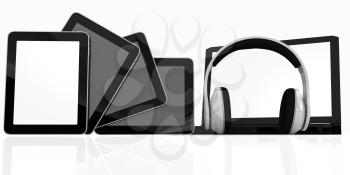 headphones on the  laptop and  tablet pc on a white background