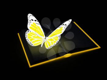 butterfly on a book on a black background