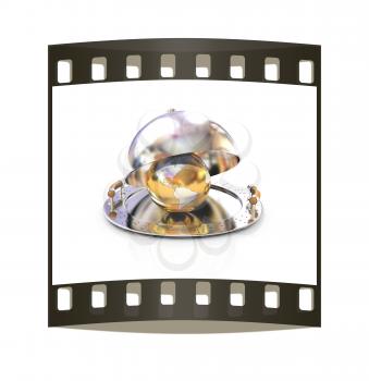 Earth globe on glossy salver dish under a cover on a white background. The film strip