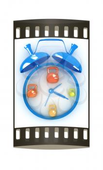 Alarm clock icon with kettlebells. Sport concept on a white background. The film strip