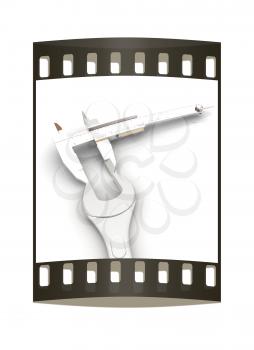 Trammel vernier on a white background measures the detail. The film strip