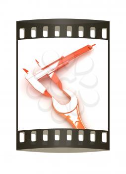 Trammel vernier on a white background measures the detail. The film strip