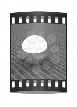 Chrome ball on the brick floor. The film strip