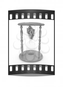 3d hourglass with the books inside on a white background. The film strip