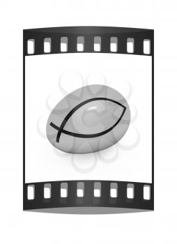 Gold egg with a symbol of Christianity ichthys(Jesus Christ is the Son of God Savior) on a white background. The film strip