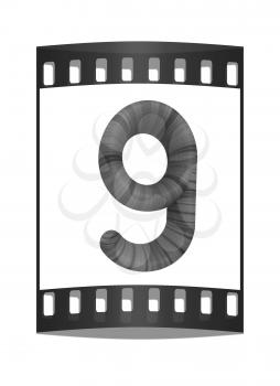 Wooden number 9- nine on a white background. The film strip