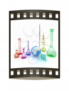 Chemistry set, with test tubes, and beakers filled with colored liquids and Earth