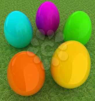 Colored Easter eggs on a green grass