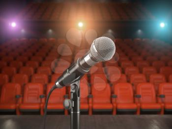 Microphone on the stage of concert hall or theater with red seats and spot light. 3d illustration