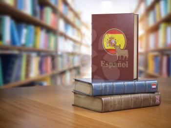 Learn Spanish concept. Spanish dictionary book or textbok with flag of Spain and cow on the cover in the library. 3d illustration