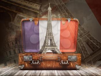 Trip to Paris. Travel or tourism to France concept. Eiffel tower andvintage suitcase with flag of France on the map of world background. 3d illustration