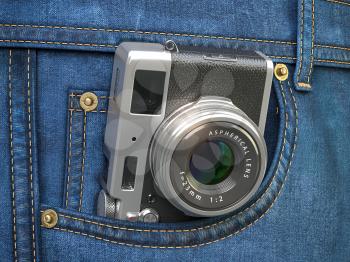 Vintage compact photo camera in jeans pocket. Blogging, travel and tourism concept. 3d illustration
