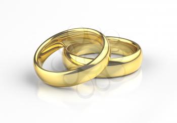 Gold wedding rings with reflection on white background.