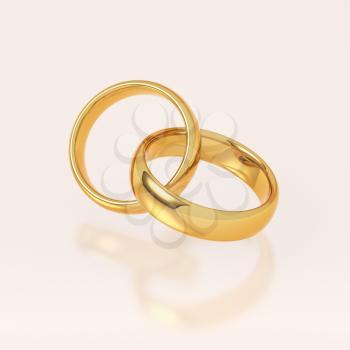 Two golden wedding rings on pink background. Love and marriage concept.
