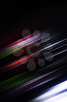Abstract digital blurred background with shining colorful lines pattern on black 