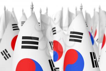 Many small flags of South Korea republic isolated on white background, 3d illustration, selective focus, shallow depth of field