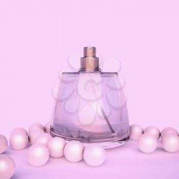 Perfume in a glass bottles and pearl beeds on pink.