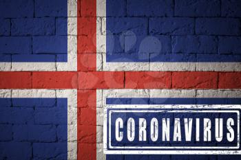 Flag of the Iceland with original proportions. stamped of Coronavirus. brick wall texture. Corona virus concept. On the verge of a COVID-19 or 2019-nCoV Pandemic.