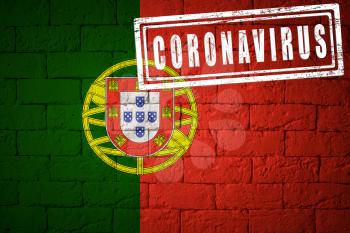 Flag of the Portugal with original proportions. stamped of Coronavirus. brick wall texture. Corona virus concept. On the verge of a COVID-19 or 2019-nCoV Pandemic.