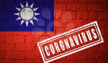 Flag of the Taiwan with original proportions. stamped of Coronavirus. brick wall texture. Corona virus concept. On the verge of a COVID-19 or 2019-nCoV Pandemic.