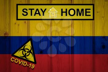 Flag of the Colombia in original proportions. Quarantine and isolation - Stay at home. flag with biohazard symbol and inscription COVID-19.