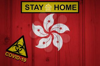 Flag of the Hong Kong in original proportions. Quarantine and isolation - Stay at home. flag with biohazard symbol and inscription COVID-19.