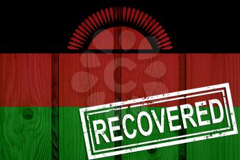 flag of Malawi that survived or recovered from the infections of corona virus epidemic or coronavirus. Grunge flag with stamp Recovered