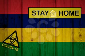 Flag of the Mauritius in original proportions. Quarantine and isolation - Stay at home. flag with biohazard symbol and inscription COVID-19.