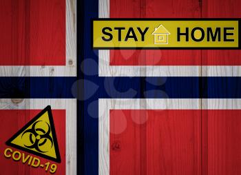 Flag of the Norway in original proportions. Quarantine and isolation - Stay at home. flag with biohazard symbol and inscription COVID-19.