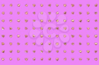 Valentine's Day abstract 3D illustration or pattern with shiny gold or golden metallic hearts in columns and rows on pink or rosy background.
