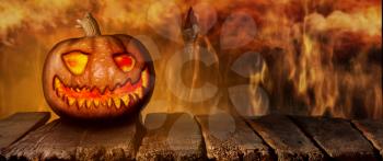 Spooky Halloween Pumpkin On a Wooden Table at Night .With Mistery Horror Background With Cemetery and Fire 3D Illustration