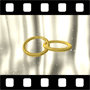 Gold rings linked with flowing satin curtain