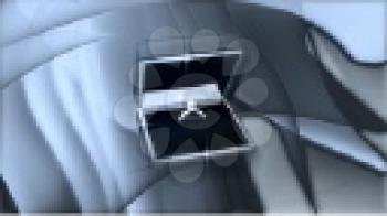 Royalty Free Video of an Engagement Ring in a Box with Shimmering Grey Background