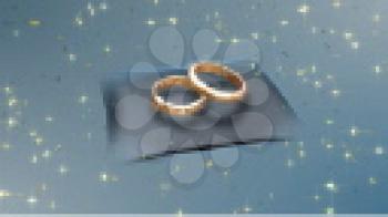 Royalty Free HD Video Clip of Rotating Wedding Rings on a Pillow